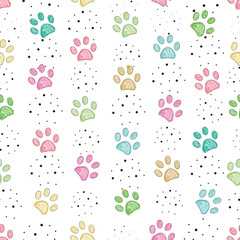 Colorful paw prints with dots seamless pattern
