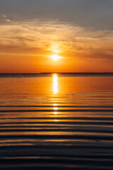 Fototapeta premium Beautiful view on golden sunset or sunrise in the sea, red and orange colors