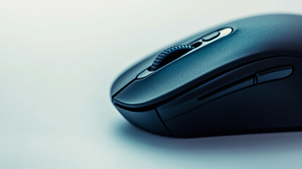 Closeup of black wireless computer cursor mouse pointer technology device object isolated on white background. electronic equipment with scroll and click buttons.