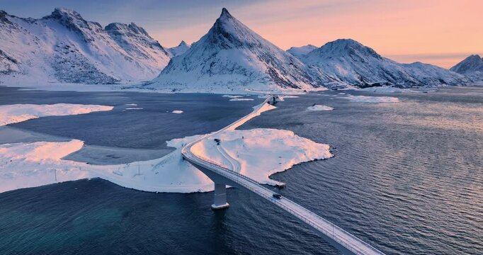 Aerial view Lofoten Islands, Norway natural landscape panorama of Fredvang Bridge, sea shores and snowy mountains peaks