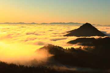 sunset over the mountains with clouds