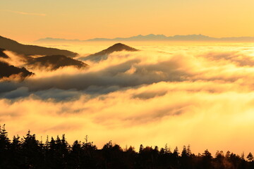 sunset over the mountains with clouds