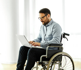disability wheelchair disabled man handicap sitting handicapped health young wheel care laptop...