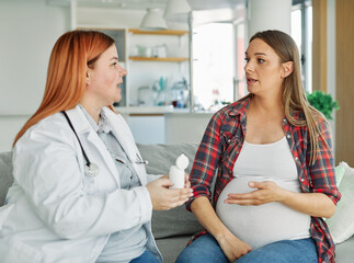 Fototapeta premium woman pregnant mother pregnancy belly doctor patient visit pill prescription tablet maternity motherhood care medicine hospital medical clinic gynecologist female consultation healthcare exam