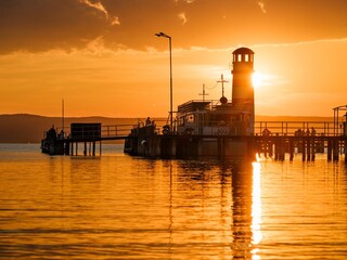 Obraz premium Village Podersdorf and the shore of Lake Neusiedl. The lighthouse at the harbor, the landmark of Podersdorf. Part of the UNESCO World Heritage Site. Austria, Burgenland