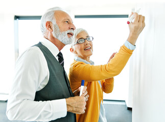 business meeting businesswoman woman elderly senior office presentation whiteboard businessman man...
