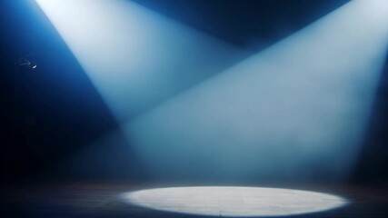 Dramatic stage bathed in blue spotlights, generating smoky atmosphere with mysterious haze, creating anticipatory setting for imminent performance or artistic event