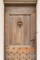 Aigues-Mortes, Gard, Occitania, France. An old wooden door in the south of France.
