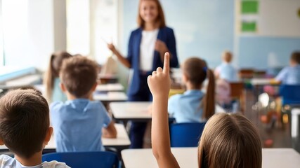 A multicultural group of children raising their hands in a classroom