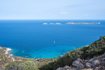 Aerial view of the small beaches on the coast of Castiadas in Sardinia with transparent, blue and turquoise water