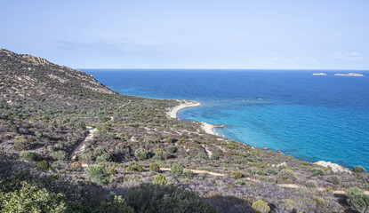 Aerial view of the small beaches on the coast of Castiadas in Sardinia with transparent, blue and turquoise water