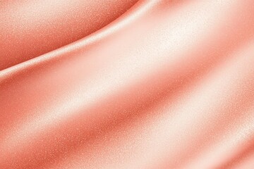 Abstract texture of smooth, flowing fabric in a soft peach hue. The surface glimmers with light, creating a serene and elegant visual ideal for backgrounds or designs.