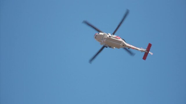 A helicopter fights a raging blaze in Malibu, showcasing the firefighting operation in stunning 4K slow motion, highlighting the crews heroic efforts against the flames. January 7, 8, 9, 2025
