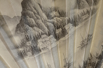 Open folding chinese fan, close up view