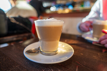 Warm coffee beverage served in a cozy cafe during afternoon hours