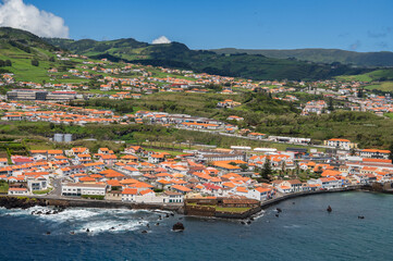Obraz premium The City of Horta and Horta Bay Faial island of the Azores, Portugal. Aerial view of Portuguese town Horta on an the Atlantic ocean coast, on a sunny day, Faial island.