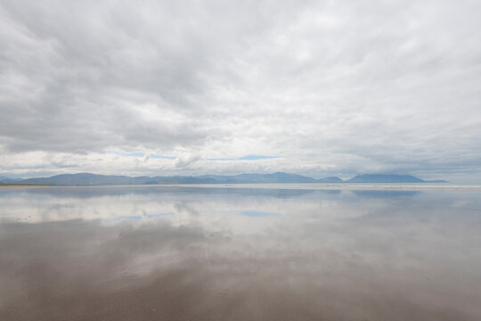 Ireland, Inch Strand. Landscape with fog on ocean and beach. - Powered by Adobe
