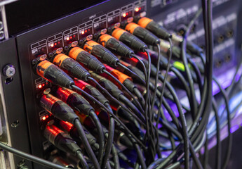 microphone plugs xlr of audio cables plugged into a mixing console or audio interface