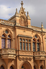 Fototapeta premium Mdina, Malta. Carmelite Church and Priory with its baroque gothic stained glass arched windows, balconies and gargoyles