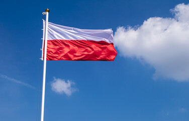 Polish flag against the sky