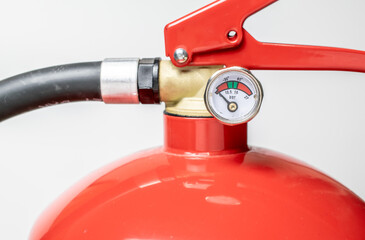 fire extinguisher. close-up of valve and pressure gauge
