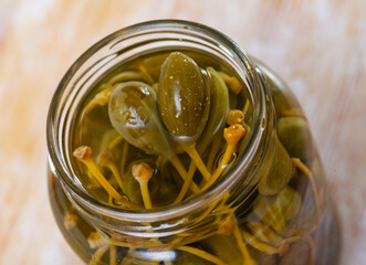 Vegetarian appetizer of canned capers in glass jar