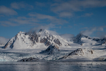 Svalbard, Norway. Landscape of glacier, mountains, snow and bay.
