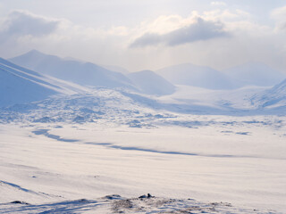 Adventdalen and glacier Dronbreen. Winter landscape on the island Spitsbergen in the Svalbard Archipelago. Scandinavia, Norway.