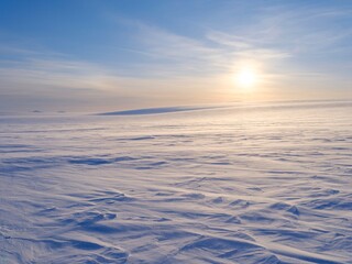 Icefield Lomonosovfonna. Winter landscape on the island Spitsbergen in the Svalbard Archipelago....
