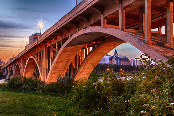 A bridge with a city in the background