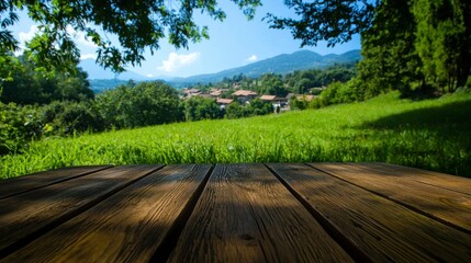 Obraz premium Rustic Wooden Tabletop Summer Landscape Idyllic Village Green Field Mountains