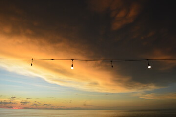 view of the sunset with the orange clouds and blue sky