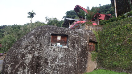Coffins and graves are placed inside rocks. This is a tradition used as a burial place for the...