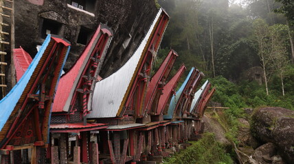 Coffins and graves are placed inside rocks. This is a tradition used as a burial place for the...