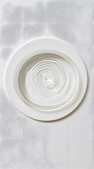 Water Ripples in Bowl on White Plate