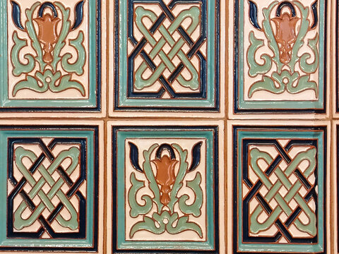Vintage ceramic tile in blue and turquoise, royal lily and lattice pattern