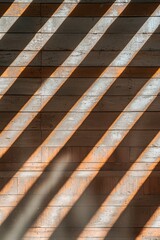 Shadows cast diagonally across a textured wooden surface create an abstract pattern.