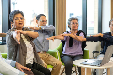 Group therapy session for asian seniors with physiotherapist, physical rehabilitation for elderly, senior fitness program group exercises, health and wellness for elderly physical therapy exercises