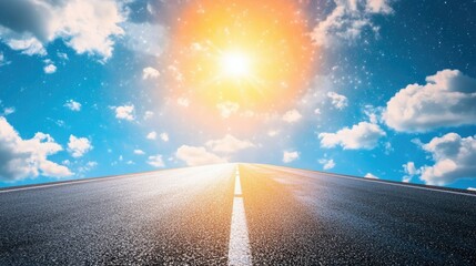 A scenic asphalt road pointing toward a bright horizon, with stars twinkling above.