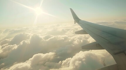 Wing of an airplane flying above the clouds