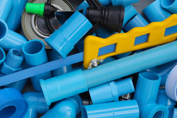 Plumber equipment with blue pvc pipe connections for plumbing work.