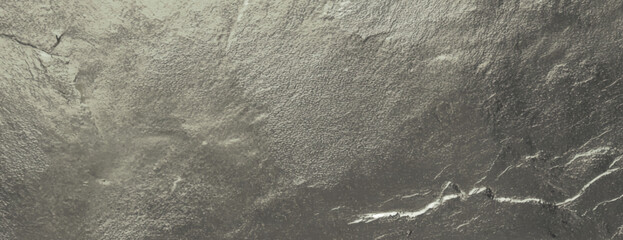 Gold background with a textured, metallic finish. The background features a rich gold color with a shimmering, uneven surface. Textured stone background vector. Gold background.