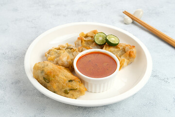 Batagor, made from fish or chicken dumpling, tofu, tapioca flour served with peanut sauce. Indonesian food
