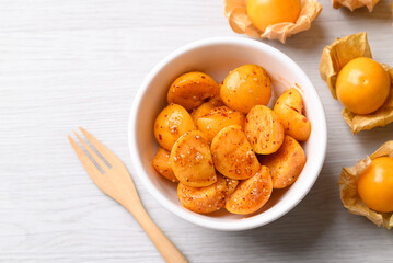 Cape gooseberry or Golden berry (Physalis peruviana) with chili powder and sugar, Spicy fruit salad