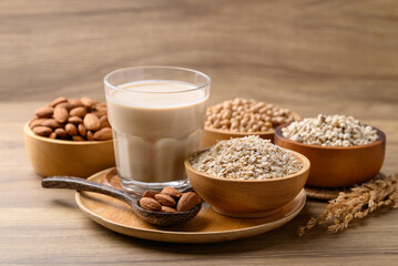 Alternative milk made from plant on wooden background, non dairy, Vegan food