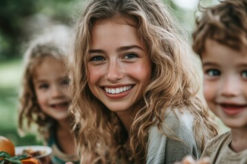Fototapeta premium A single mother and her children enjoying a picnic in the park, smiling and eating together.