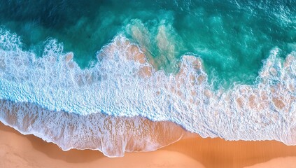 Fototapeta premium Ocean Waves Crashing on Sandy Beach: Aerial View of Turquoise Water, White Foam, Coastal Serenity, Summer Vacation, Relaxing Scenery