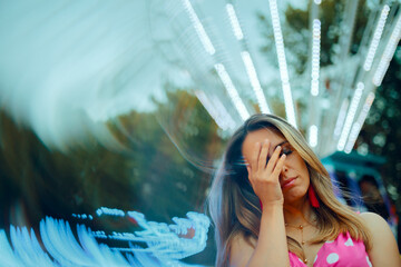 
Woman feeling Dizzy from all the Ferris wheel Rides in a Funfair
Stressed girl suffering vertigo...