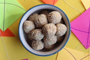 Til gul ladu or sesamum ladoo or sesame laduu, sweet balls made with sesame, peanuts and jaggery, Indian festival food