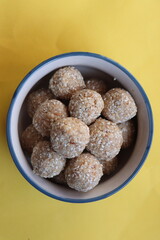 Til gul ladu or sesamum ladoo or sesame laduu, sweet balls made with sesame, peanuts and jaggery, Indian festival food